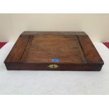 A 19th century mahogany writing box, the sloping fall enclosing a fitted interior. 23' wide