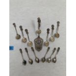 Continental silver. A set of seven teaspoons, a set of six coffee spoons and a cake slice. Marked '