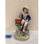 A 19th century Staffordshire group, boy seated with a monkey. 7¼' high