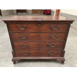 An 18th century mahogany chest, the top drawer fitted with slide revealing a compartmented