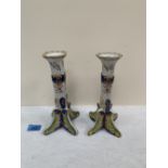 A pair of 19th century French faience candlesticks. 8½' high