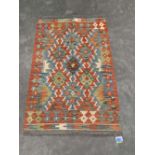 A Choli Kilim rug. 1.2m x 0.8m