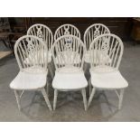 A set of six painted wheelback chairs