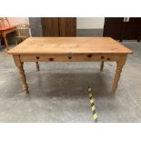 A pine kitchen table with heart pierced frieze on turned legs. 68' L x 38' W