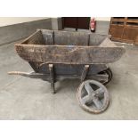 A vintage pine wheelbarrow. 51' long