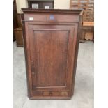 A George III oak hanging corner cupboard. 48' high