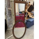 Two oak framed wall mirrors