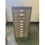 A ten drawer metal filing cabinet. 28' high