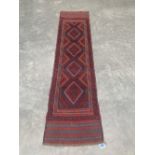 A Meshwani carpet runner. 2.44m x 0.62m