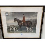 After Stephen Pearce. A coloured engraving by Charles Mottram of a huntsman and hounds. Framed and