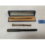 Two plated propelling pencils and a Macniven and Cameron No.9 fountain pen with 14k nib