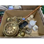 A quantity of brassware with four royal commemorative mugs and a bellows camera