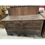 An 18th century joined oak chest, with two full fronts (formerly drawers) over a pair of base