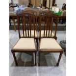 A set of four 1920s oak dining chairs