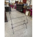 A metal clothes airer. 35'w x 48'h