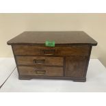 A miniature oak chest of four drawers. 15½' wide