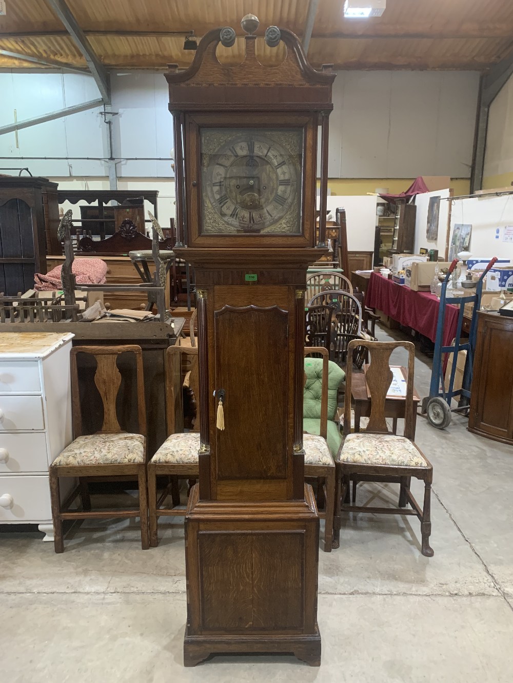 An 18th century oak and mahogany 8 day longcase clock, the 12' brass and silvered dial signed