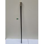 A 19th century walking cane, the silver pommel moulded with a Chinese dragon. 34½' long