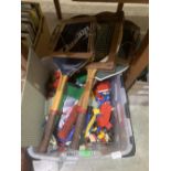 A box of Lego and three vintage tennis racquets