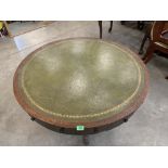 A Regency oak drum table, the leather inlet top over two real and six faux drawers, one stamped