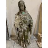 An antique carved limestone ecclesiastical figure. 36' high. Head detached, losses, heavily