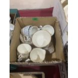 Four boxes of tea and dinnerware