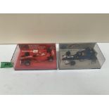 Minichamps Paul's Model Art. Two 1-43 scale boxed models. Ferrari F300 Michael Schumacher and Sauber