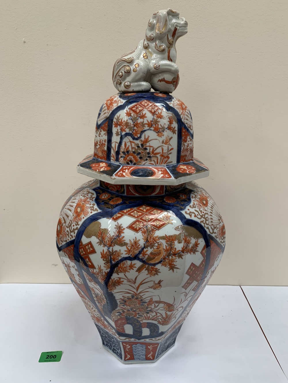 A Japanese Imari octagonal inverted baluster jar, the domed cover with dog of Fo finial. Meiji.