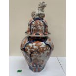 A Japanese Imari octagonal inverted baluster jar, the domed cover with dog of Fo finial. Meiji.