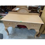 A painted dressing table with three drawers on square cabriole legs. 52' wide