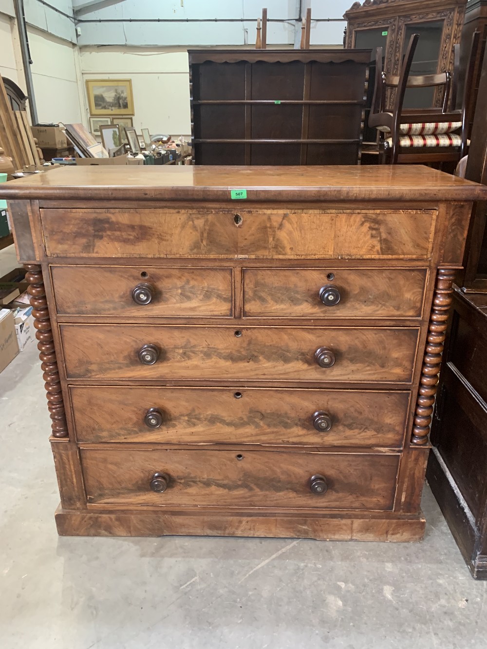 A Victorian Scottish mahogany chest of two short over three long drawers flanked by bobbin turned