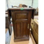 A late Victorian walnut dropleaf bedside cabinet