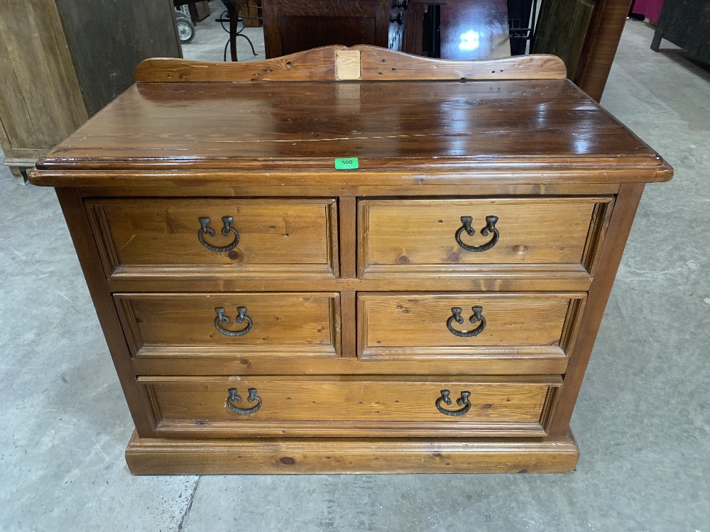 A stained pine chest of five drawers. 42' wide