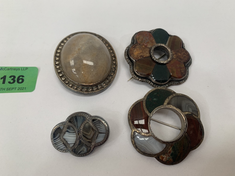 Three Scottish hardstone brooches and one other