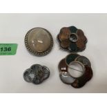 Three Scottish hardstone brooches and one other