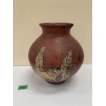 A terracotta jar with classical style figure decoration