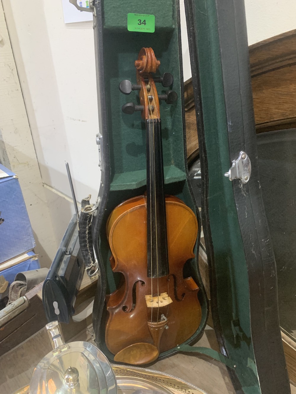 A cased Chinese violin. Bow lacking