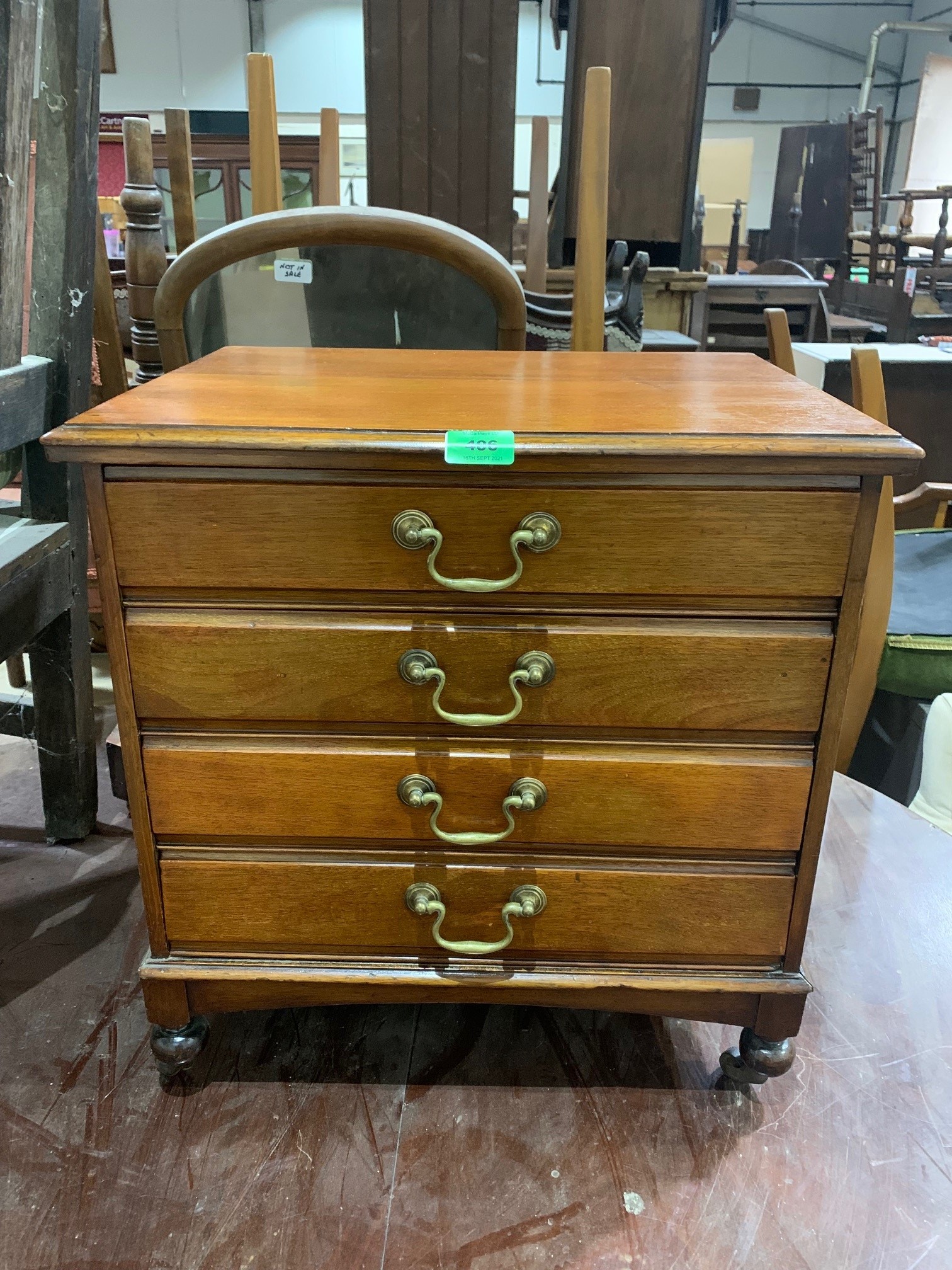 An early 20th century mahogany music chest of four fall-front drawers. 20' high