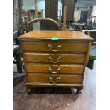 An early 20th century mahogany music chest of four fall-front drawers. 20' high