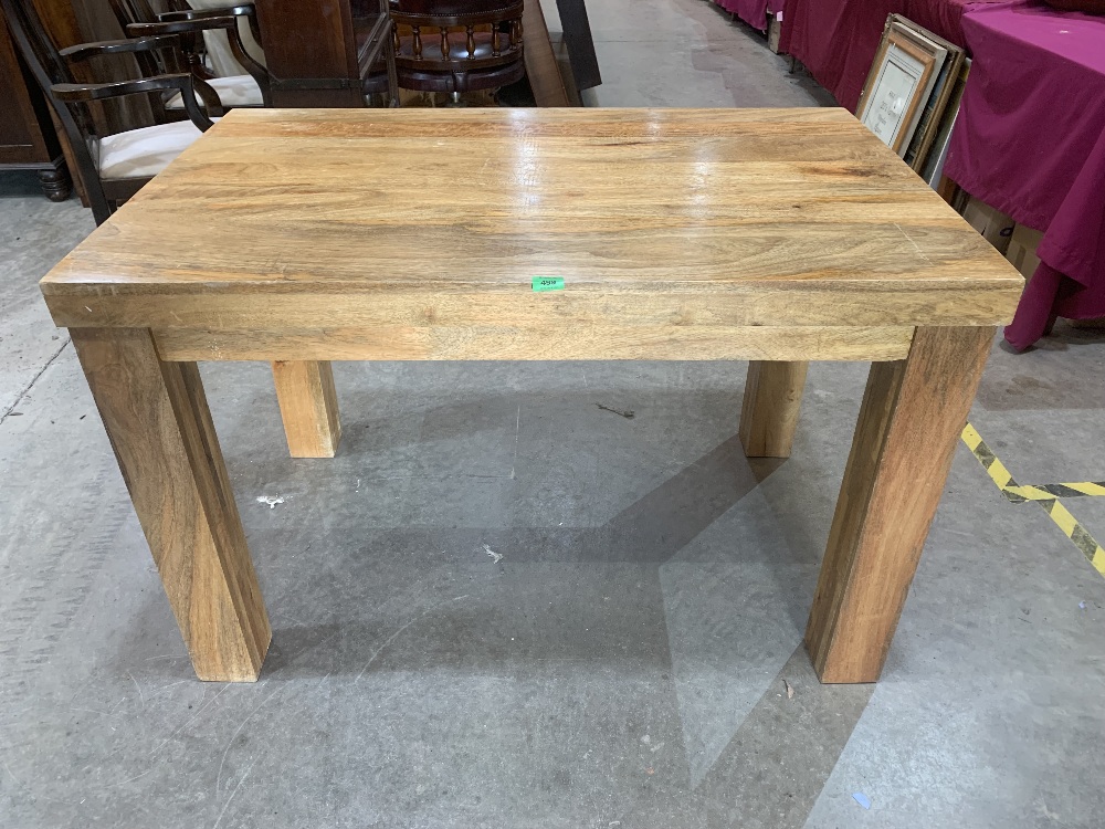 A hardwood table on square legs. 46½'l x 30'w