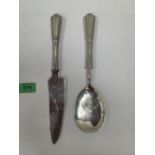 A French white metal serving spoon and knife. Minerva mark
