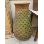 A terracotta baluster garden pot with pineapple moulded body. 37½'h