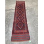 A Meshwani carpet runner. 2.44m x 0.62m