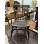 A 19th century oak child's chair with stick back on turned splayed legs