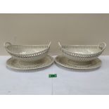A pair of early 19th century Wedgwood creamware basket weave moulded tureens and stands with