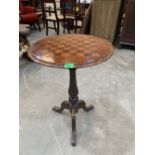 A Victorian walnut tripod occasional table with chessboard top