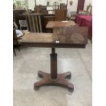 An early Victorian mahogany reading table on facetted column and quadripartite platform support.