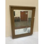 A 19th century gilt framed wall mirror. 31' high