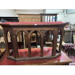 A 19th century pitch pine arcaded lancet fronted side table