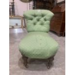 A Victorian walnut lady's parlour chair with deep buttoned back